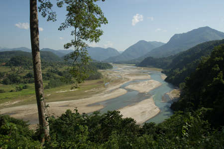A stream meanders through the Himalaya in Nepalの写真素材