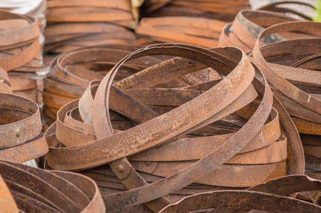 A stack of rusty barrel hoops at a cooperage in Dufftown, Scotlandの写真素材