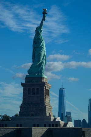 Statue of Liberty with One Wrold trade center in the background