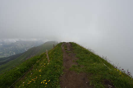 A trail hiking path in Alps Mountains.の写真素材