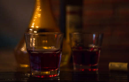 Two glasses of red wine bar phone hookah