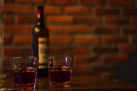 two glasses of red wine bar phone hookahの写真素材