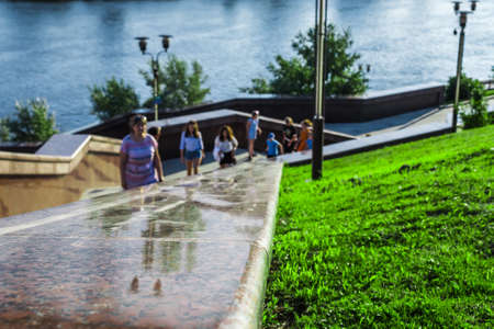 the promenade watching people look crowd the river hikeの写真素材