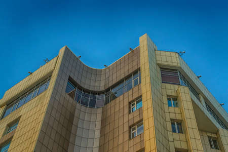 building on the background of blue sky and the city up buildings