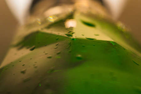 a bottle of beer and a drop of water closeup macro photo of Saint Patrickの写真素材