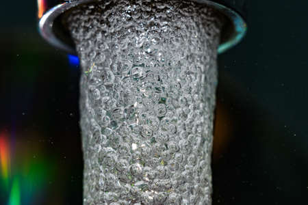 tap water closeup macro photo bubbles close upの写真素材