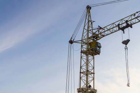 Crane builds a house construction in winter Siberia Russia