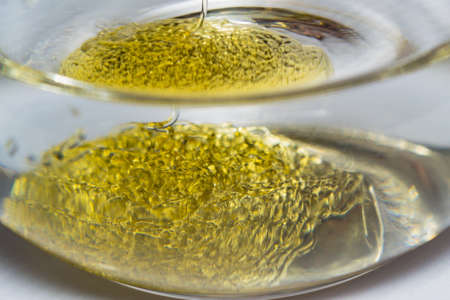 honey in water macro photo close-up of a stream of honeyの写真素材