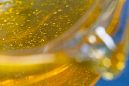 honey in a glass vessel macro photo closeupの写真素材