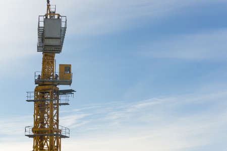 Crane builds a house construction in winter Siberia Russiaの写真素材