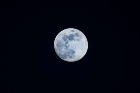 full moon in the black sky 500 focal lengthの写真素材