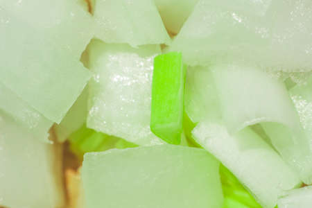 green onions texture macro photo on the Board to cut the onionの写真素材