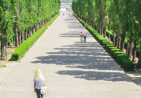 woman looking forward from behind Mamayev Kurgan summer
