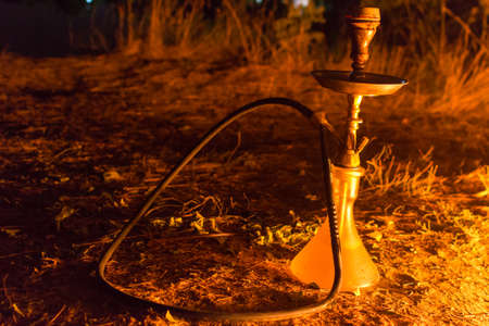hookah by the fire at night in the countryside on cloud