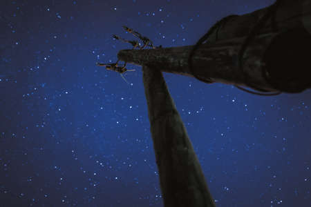 Pillar of fire lighting the old dilapidated against the night skyの写真素材