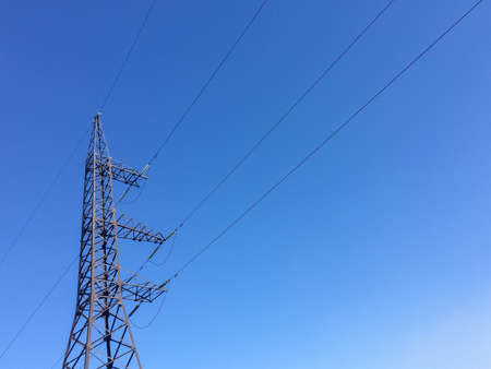 electric wire tower on a blue background electricity in the city
