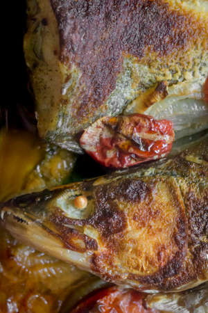fish pike-perch baked close-up vertical top viewの写真素材