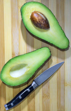 cut avocado on a Board healthy eating close-upの写真素材