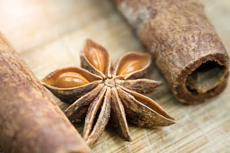 spices for mulled wine star anise and cinnamon close up macroの写真素材