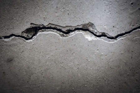 crack in concrete wall closeup retro style dirty concrete cement