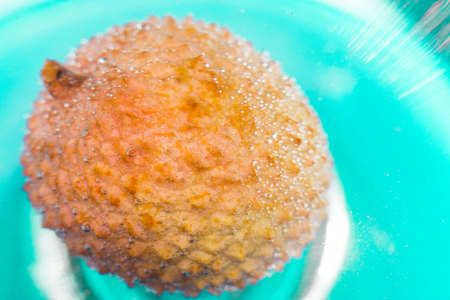 lychee fruit is an exotic fruit in water closeup macro photographyの写真素材