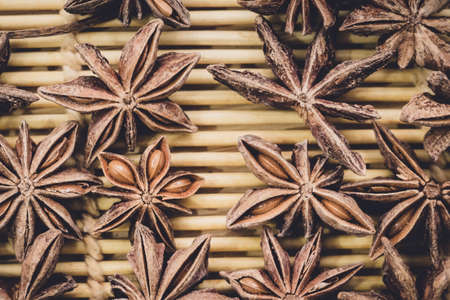 anise spice Badian texture close-up on wooden backgroundの写真素材