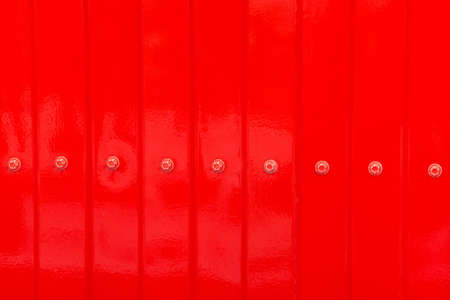 Red zinc texture wall,metal floor. Red tile roof floor background. Closeup roofing texture patternの写真素材