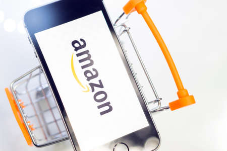 online shopping Amazon company logo online store on the phone screen close-up