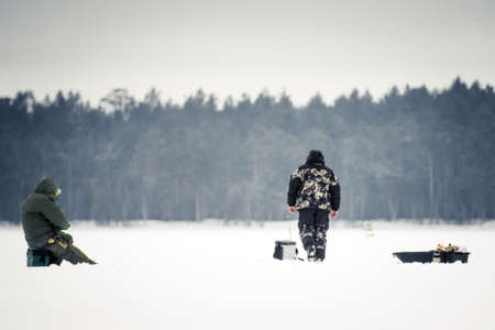 fishermen in the winter for ice fishing