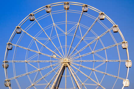 Ferris wheel in summer on blue sky amusement Parkの写真素材