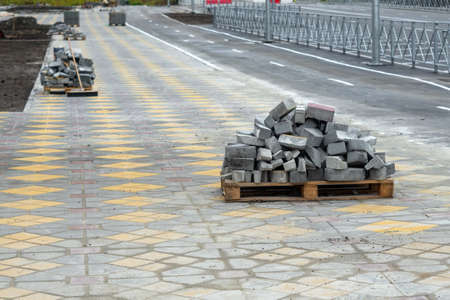 construction of roads reconstruction of the sidewalk. Preparation for construction arrangement of the cityの写真素材