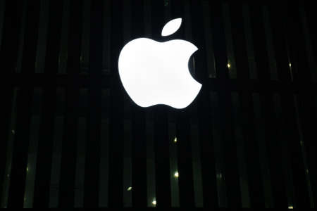 Tyumen, Russia - October 01, 2019: Apple iPhone office logo on black background at night