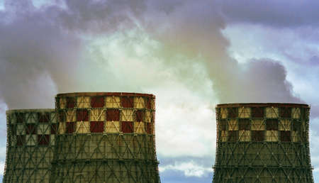 towers of thermal power plant. The concept of environmental pollution industry smoke from pipes factory factoryの写真素材