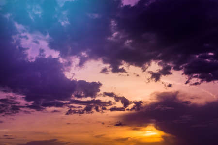 Beautiful cloudscape with colorful contrasting clouds at sunset. natural backgroundの写真素材