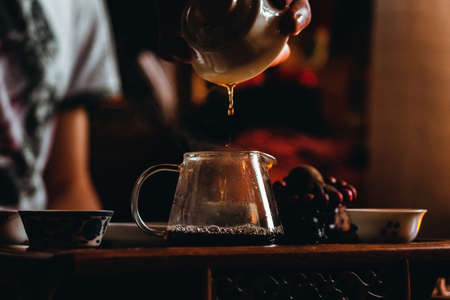 tea ceremony, pouring tea, a Chinese tea closeup. selective focusの写真素材