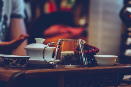 Tea ceremony. The man pours hot chinese tea into the tea cupの写真素材
