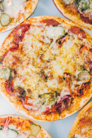 Pizza with Mozzarella cheese, sausage, Tomato sauce, Spices and peppers, bacon, vertical photo