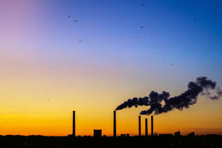 Factory pipe polluting air, environmental problems, ecology theme, the smoke from the chimneys....