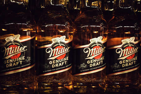 Tyumen, Russia-March 06, 2020: Miller alcoholic beer ready for sale on the shelf in superstore. Various bottled alcoholic. sale of alcoholのeditorial素材