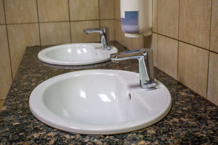 it is a row of male urinal or pee toilet in public place.の写真素材