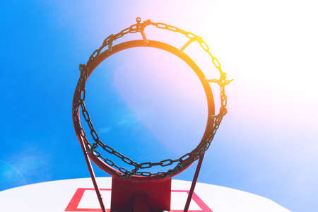 street basketball court ring board against the sky. bright sunny day