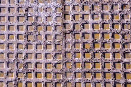 old square tile background texture. Background of the old and damaged small square tilesの写真素材