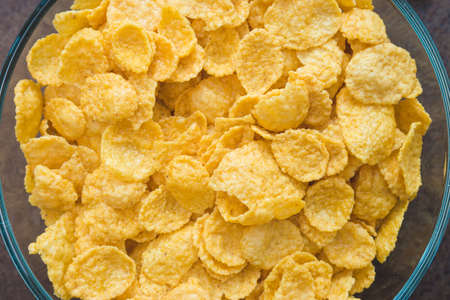 Tasty crispy corn flakes in bowl . Selective focus. Shallow depth of field.