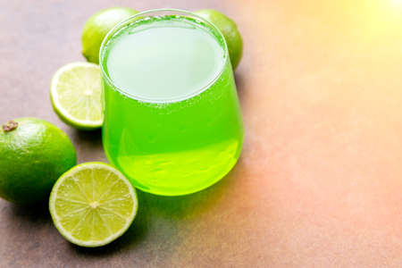 limes juice, lemonade in a glass glass. Healthy lifestyle and detox conceptual background, selective focusの写真素材