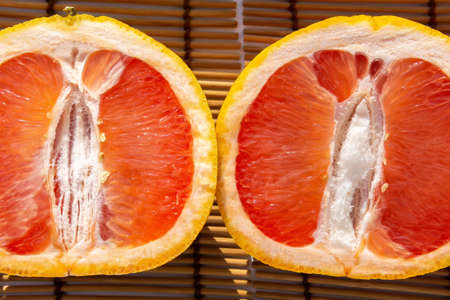 grapefruit cut in half close-up. Citrus vitamin selective focusの写真素材