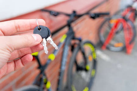 secure bicycle cable lock. Lockpicking Bicycle Padlock. Selected focus.の写真素材