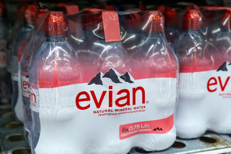 Tyumen, Russia-June 05, 2020: Evian brand drinking water, are placed on shelves display in the grocery store.のeditorial素材