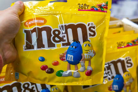 Tyumen, Russia-June 05, 2020: M Ms candies. M Ms produced by Mars, Incorporated. Close up of a pile of colorful chocolate packaging in a hypermarketのeditorial素材