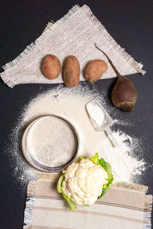 Cauliflower potatoes beets for the preparation of flour from vegetables. top view of flat layの写真素材