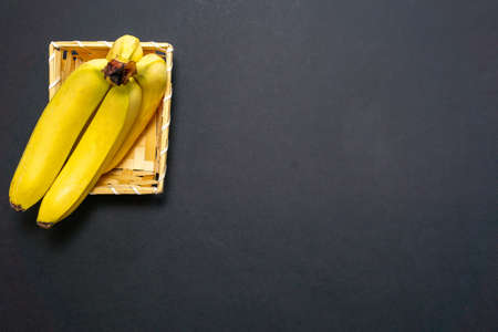 yellow bananas on a black background place for copy space textの写真素材